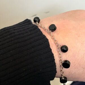 Black Disc Shaped Dangling Beaded Bracelet with Delicate Chain Design